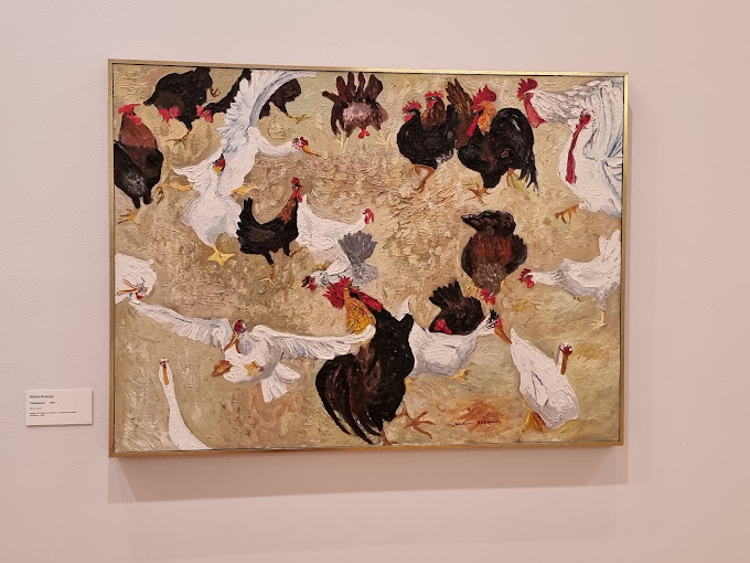 Oil painting of chickens and roosters on display inside the gallery