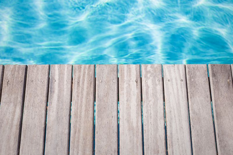 Close-up of timber deck boards beside a swimming pool
