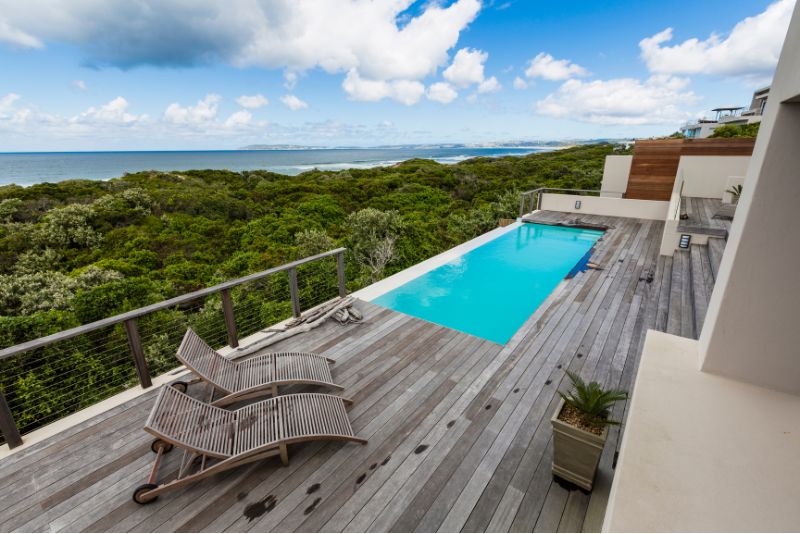 Pool deck furnished with outdoor furniture for extra living space